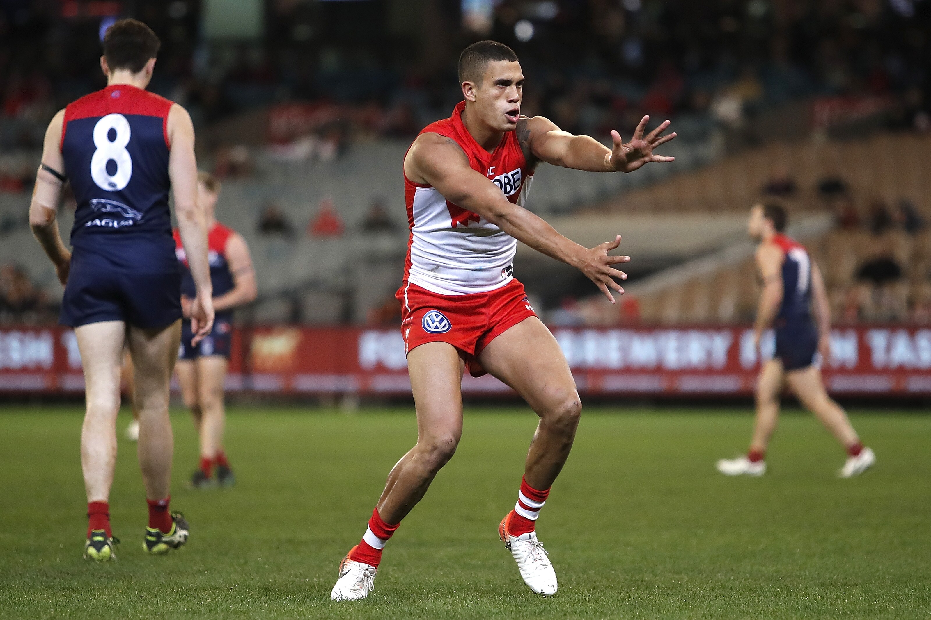 AFL 2019 Round 22 - Melbourne v Sydney MELBOURNE, AUSTRALIA - AUGUST 16: James Bell of the Swans celebrates a goal during the 2019 AFL round 22 match between the Melbourne Demons and the Sydney Swans at the Melbourne Cricket Ground on August 16, 2019 in Melbourne, Australia. (Photo by Dylan Burns/AFL Photos)